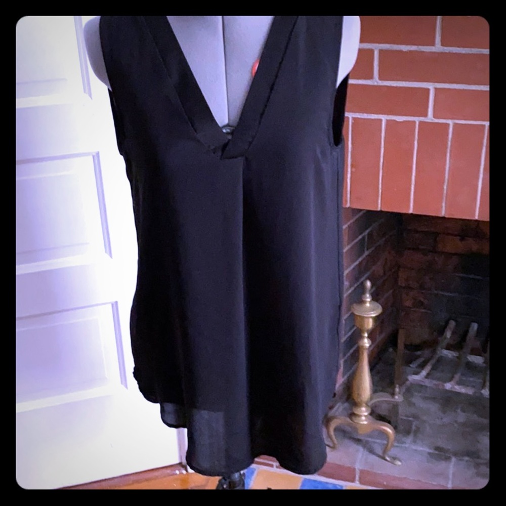 Black tunic length sleeveless blouse